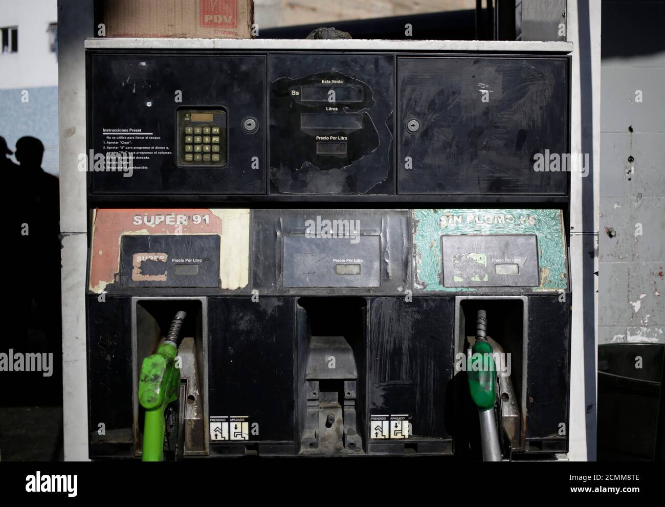 A  fuel dispenser at a gas station of state oil company Petroleos de Venezuela (PDVSA) is seen in Caracas, February 16, 2016. After the price hike, which translated to 1,329 percent for 91-octane-rated gasoline and 6,086 percent for 95 octane, still left fuel as one of the cheapest buys in the country. Venezuela's 91 octane gasoline now costs 1 bolivar per liter and 95 octane gasoline 6 bolivars - the latter being 60 U.S. cents at the strongest official rate, but just $0.006 on the black market. Picture taken February 16, 2016. REUTERS/Marco Bello Stock Photo