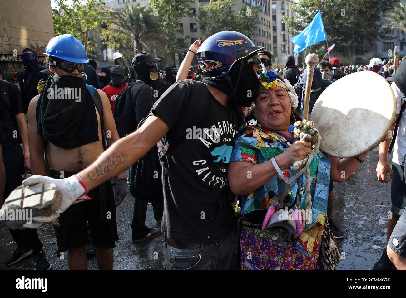 A demonstrator kisses a Mapuche woman during anti-government protests in Santiago, Chile January 24, 2020. REUTERS/Edgard Garrido Stock Photo