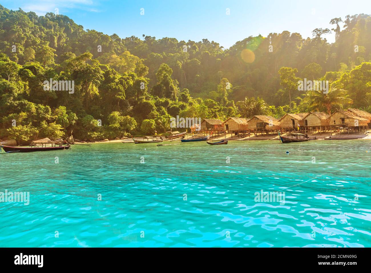 Fisherman village landscape of Ko Surin Marine National Park. Traditional long-tail boats and houses of Moken tribe Village or Sea Gypsies and Stock Photo