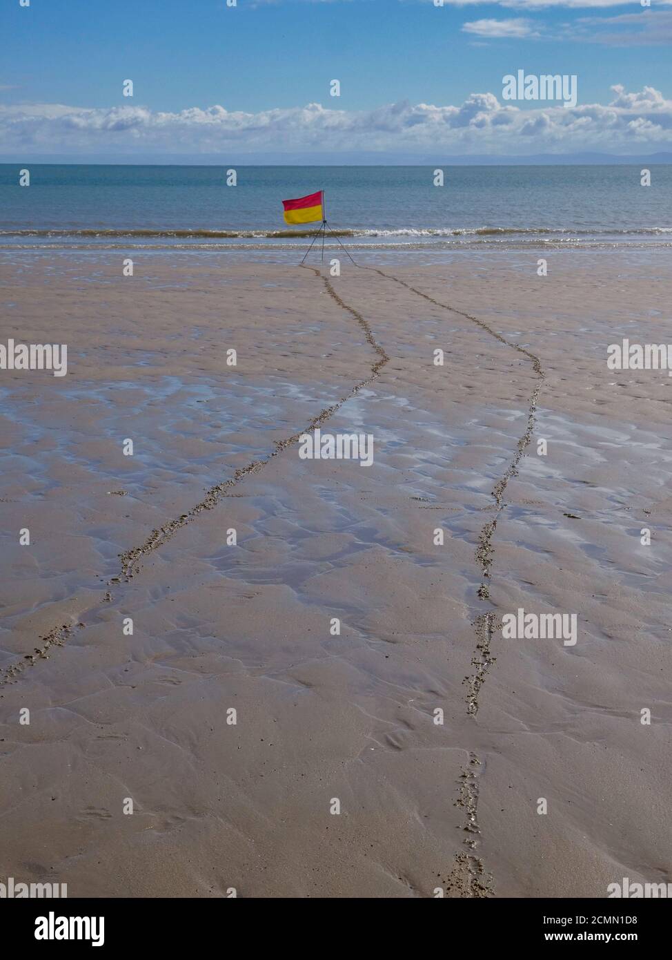 Lifeguard warniing flags on the beach at Port Eynon on the Gower penisula Wales UK Stock Photo