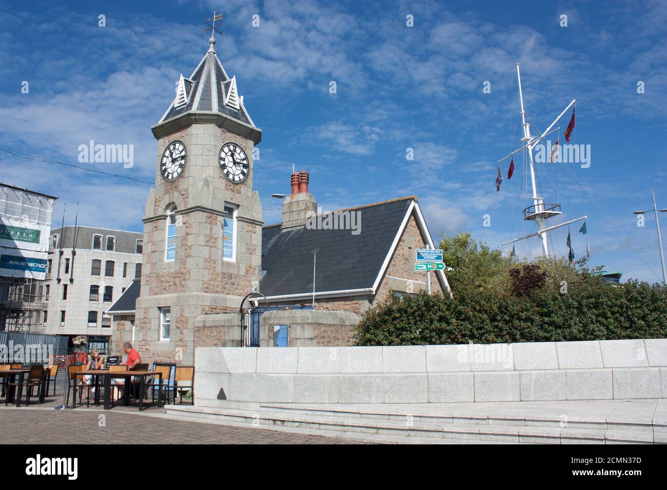 Channel Islands. Guernsey. St Peter Port. Weighbridge Clock Tower building and roundabout flag pole. Stock Photo