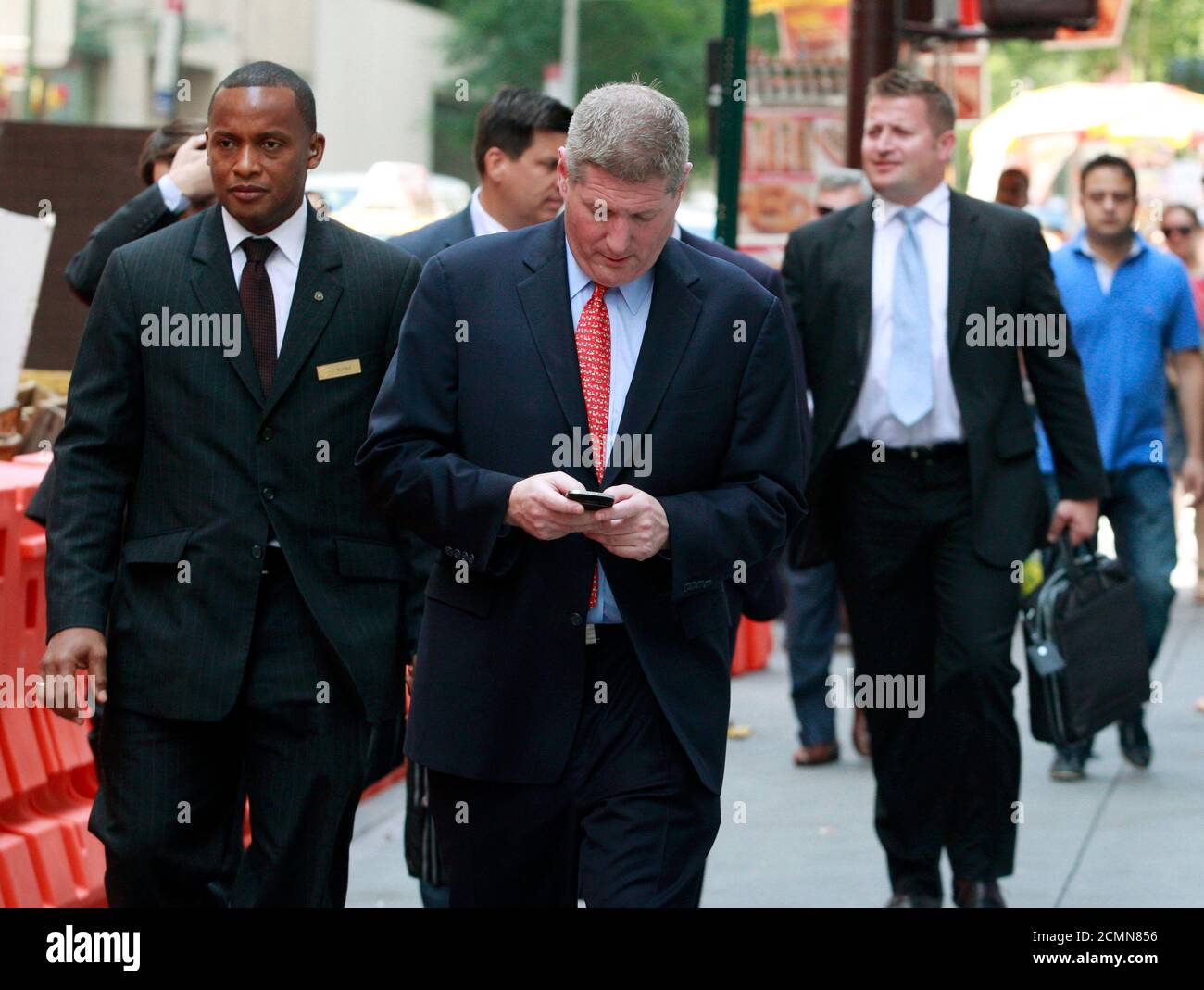 Members of the Manchester United Ltd. road show marketing team exit following their meetings with bankers in New York, August 6, 2012. Manchester United Ltd's owners stand to make about three times their investment in the British soccer club if it successfully goes public. REUTERS/Brendan McDermid (UNITED STATES  - Tags: BUSINESS SPORT SOCCER) Stock Photo