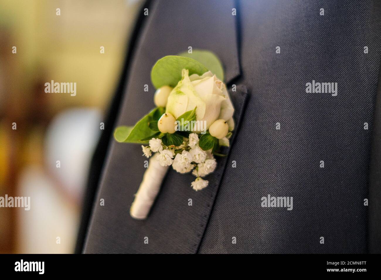 rose flower in the boutonniere of the groom's suit for wedding. High quality photo Stock Photo