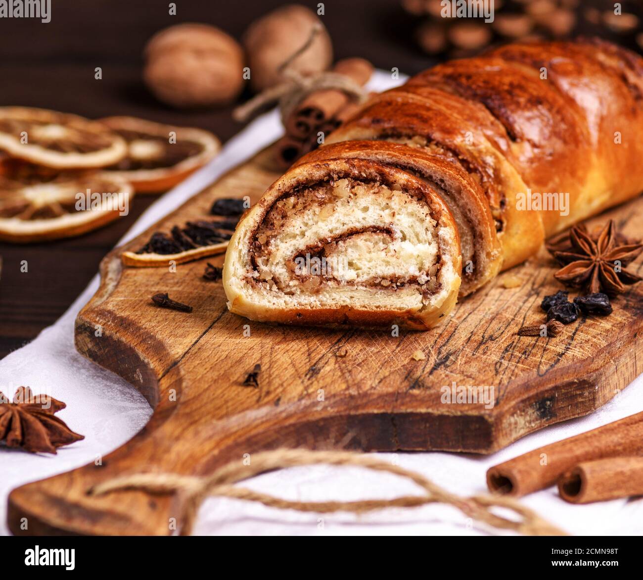baked roll with cinnamon and nuts Stock Photo