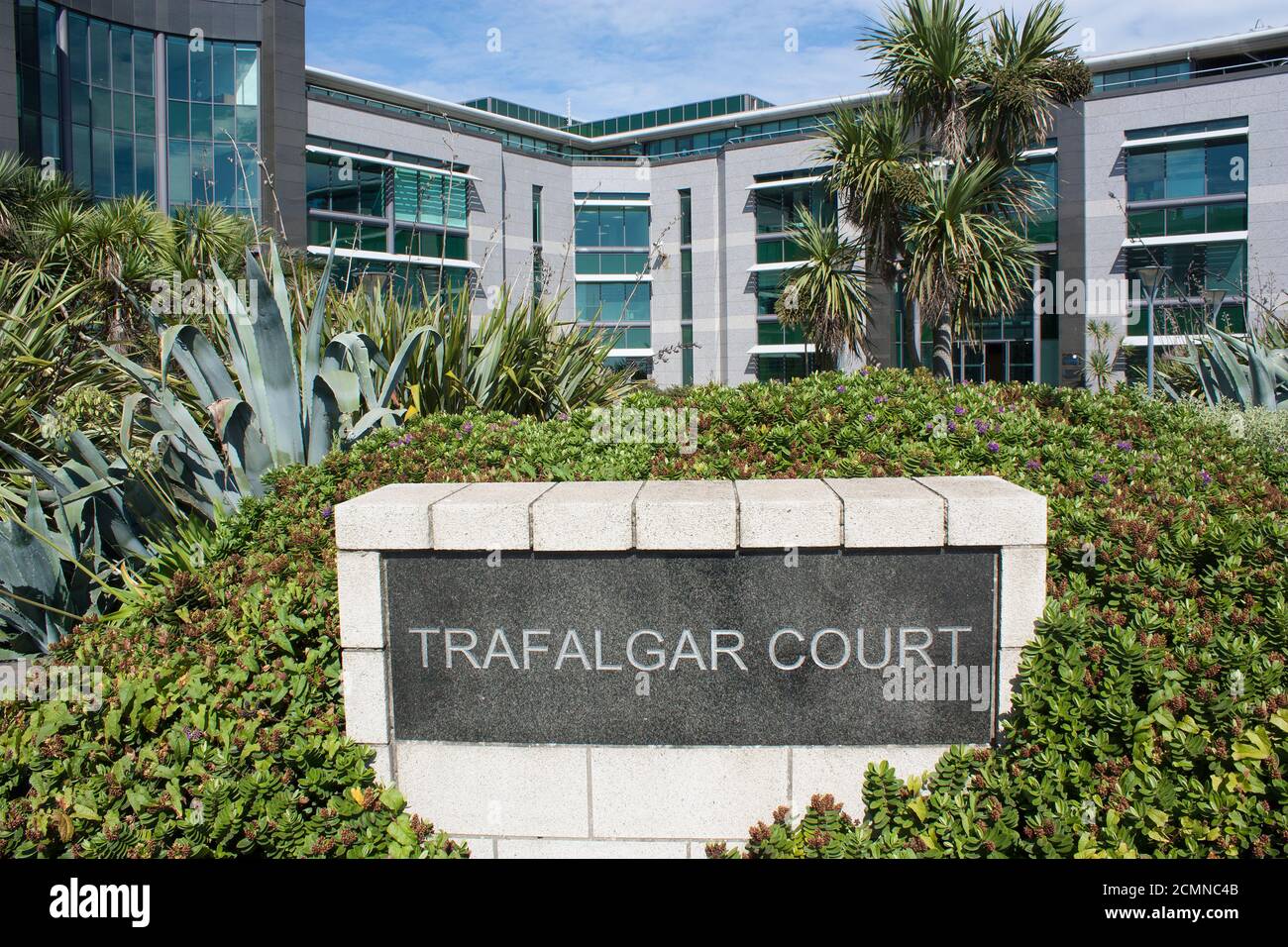 Channel Islands. Guernsey. St Peter Port. St George's Esplanade. Admiral Park. Trafalgar Court. Sign at front of building. Stock Photo