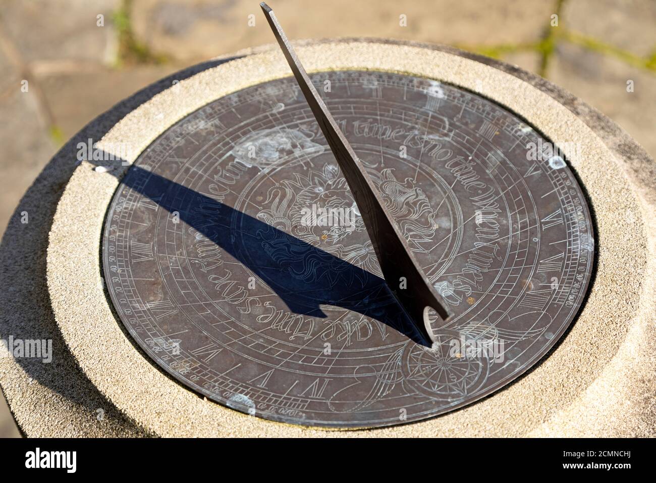 A sundial shows the time. The shadow is cast by a gnomon. Stock Photo