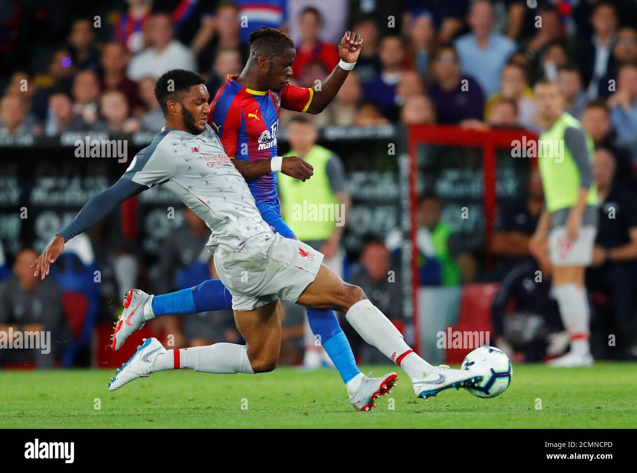 Soccer Football - Premier League - Crystal Palace v Liverpool - Selhurst Park, London, Britain - August 20, 2018 Crystal Palace's Wilfried Zaha in action with Liverpool's Joe Gomez REUTERS/Eddie Keogh EDITORIAL USE ONLY. No use with unauthorized audio, video, data, fixture lists, club/league logos or "live" services. Online in-match use limited to 75 images, no video emulation. No use in betting, games or single club/league/player publications. Please contact your account representative for further details. Stock Photo