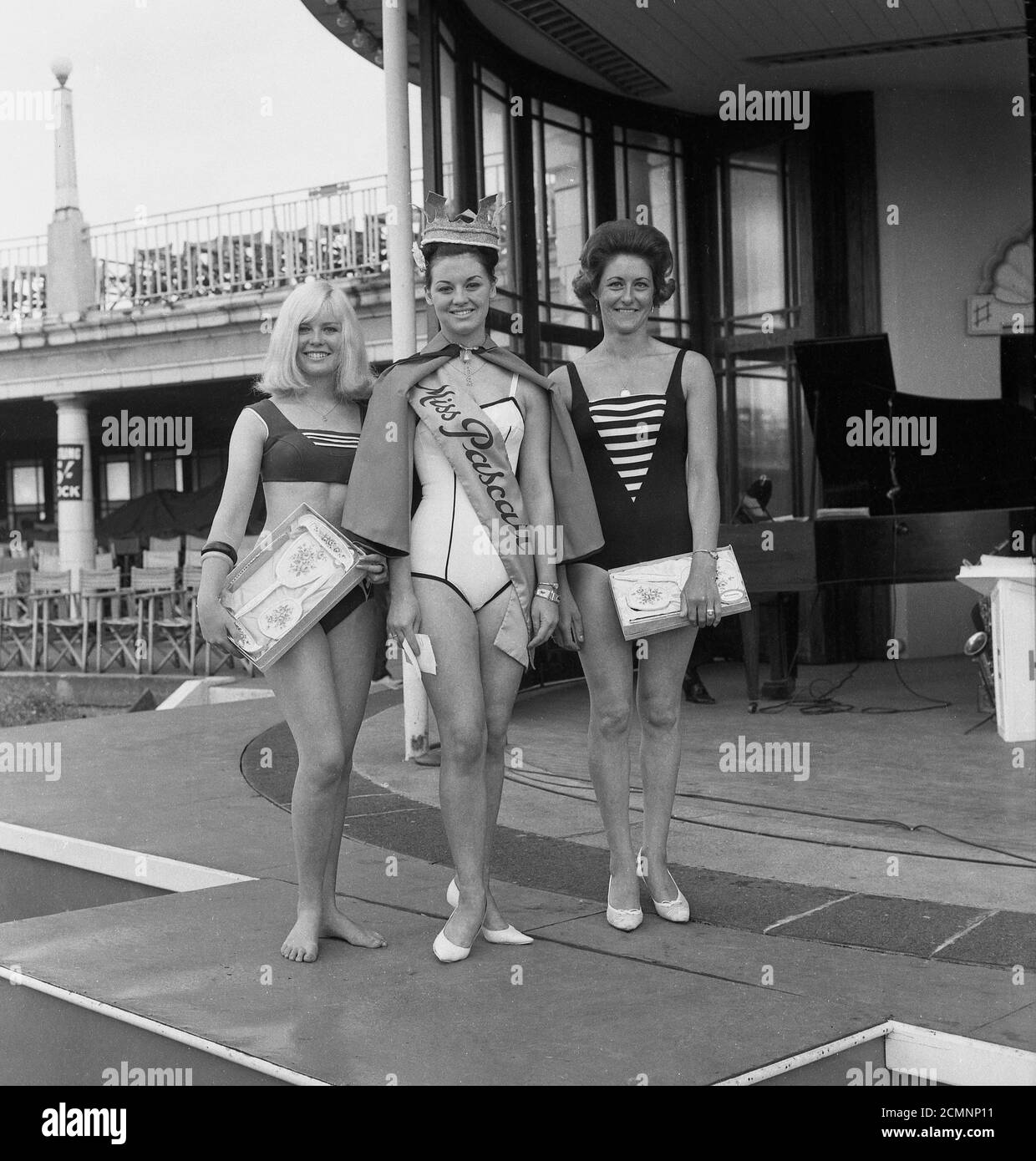 1960s, historical, Beauty Queen, Miss Pascall, with two other contestants wearing swimsuits, tanding together for a photograph at the bandstand at Scarborough, England, UK. Stock Photo