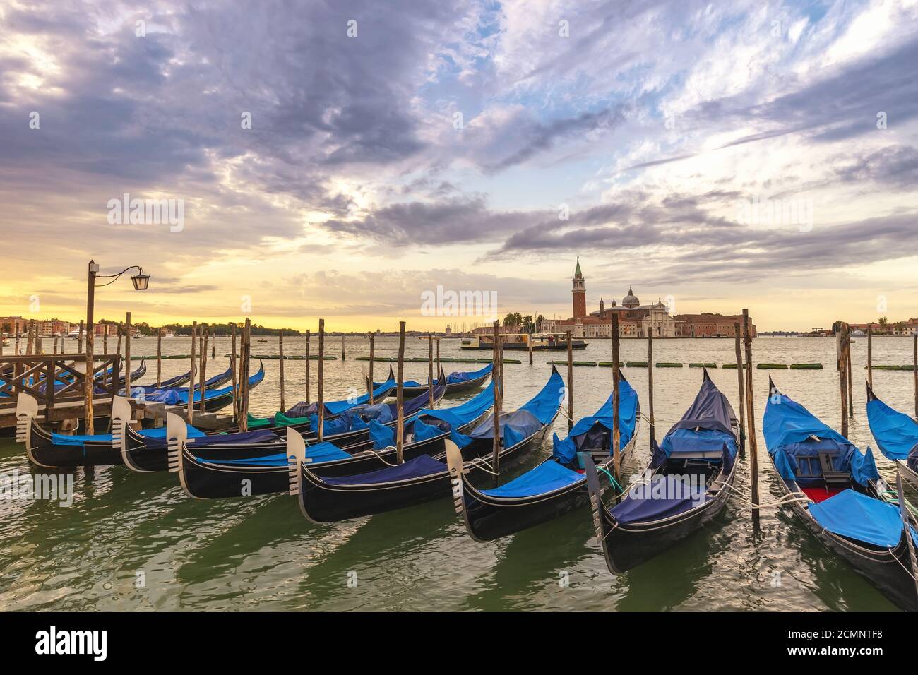 Venice sunrise city skyline and Venice Gondola boat, Venice Italy Stock Photo