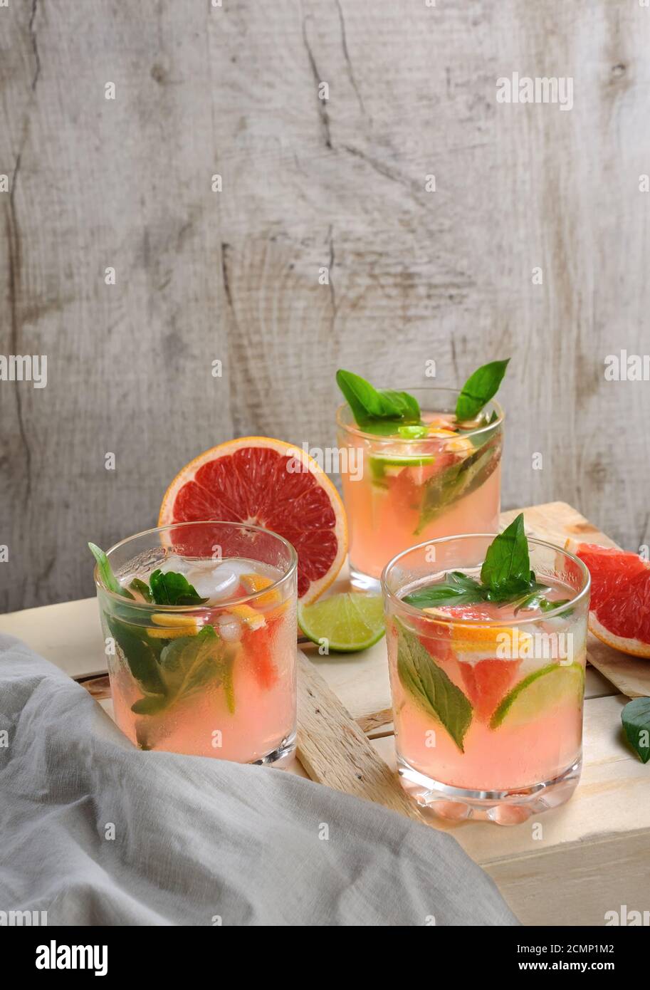 Cocktail of juice squeezed red grapefruit and leaves of delicate lemon
