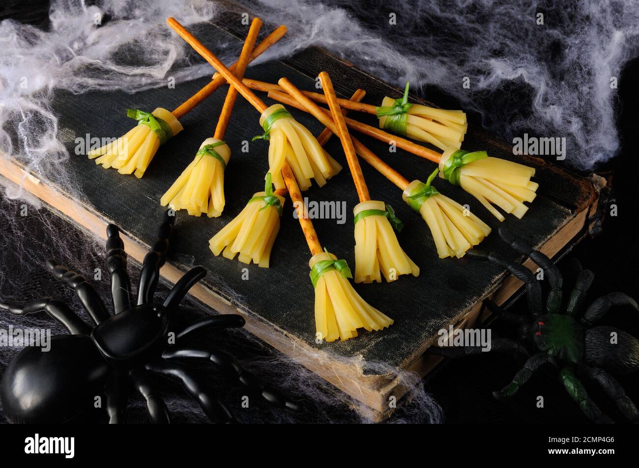 Witch broom made of cheese and bread straw. The original idea of serving snacks Stock Photo
