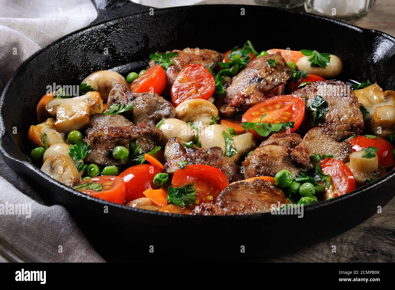 Fried chicken liver with vegetable side dish of tomatoes, carrots