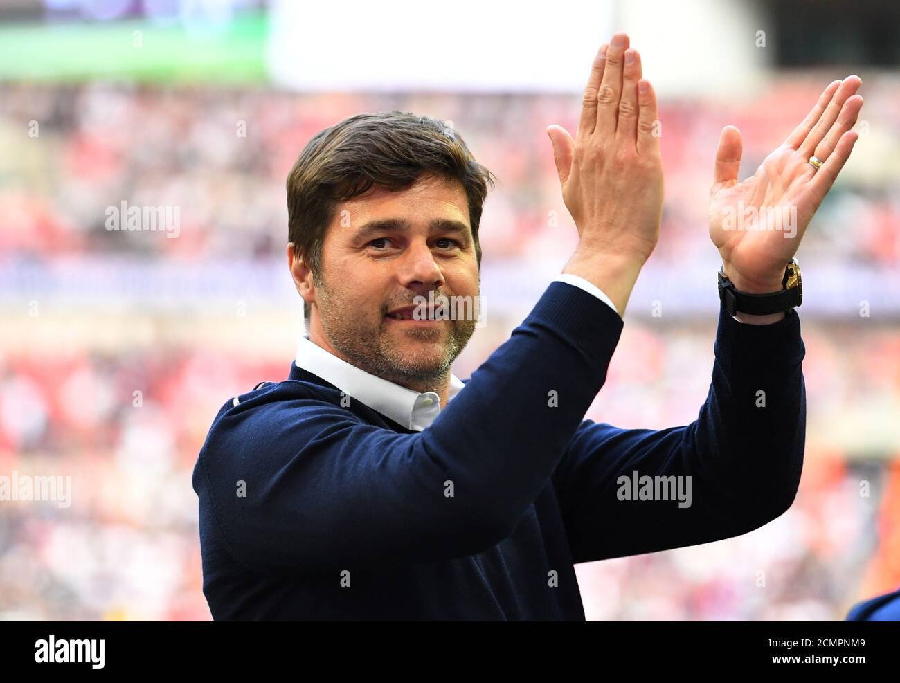 Soccer Football - Premier League - Tottenham Hotspur vs Leicester City - Wembley Stadium, London, Britain - May 13, 2018   Tottenham manager Mauricio Pochettino waves to their fans after the match   REUTERS/Dylan Martinez    EDITORIAL USE ONLY. No use with unauthorized audio, video, data, fixture lists, club/league logos or 'live' services. Online in-match use limited to 75 images, no video emulation. No use in betting, games or single club/league/player publications.  Please contact your account representative for further details. Stock Photo