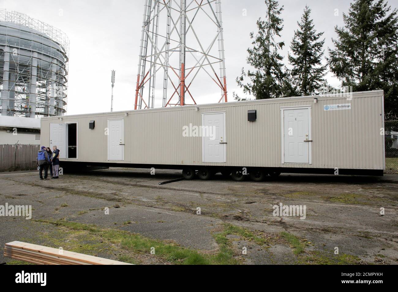 King County officials stand next to one of 18 modular units that King County is using to house patients for treatment and isolation in relation to coronavirus in Seattle, Washington, U.S. March 3, 2020.  REUTERS/David Ryder Stock Photo