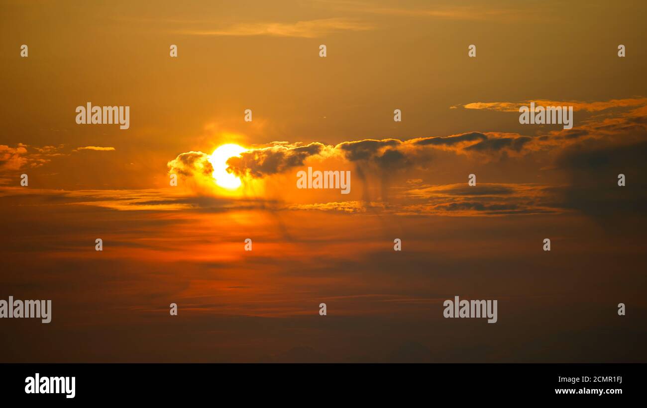 Beautiful scenery of the sunset sky with fluffy clouds Stock Photo - Alamy
