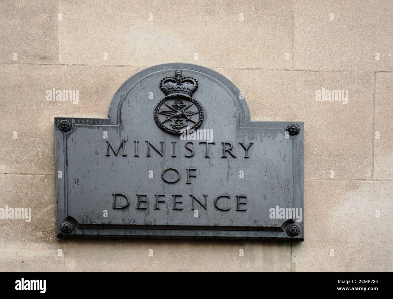 Ministry of Defence plaque.  This is located on the wall of the MOD building in whitehall gardens, London.  It is a Grade 1 Listed Building and is res Stock Photo