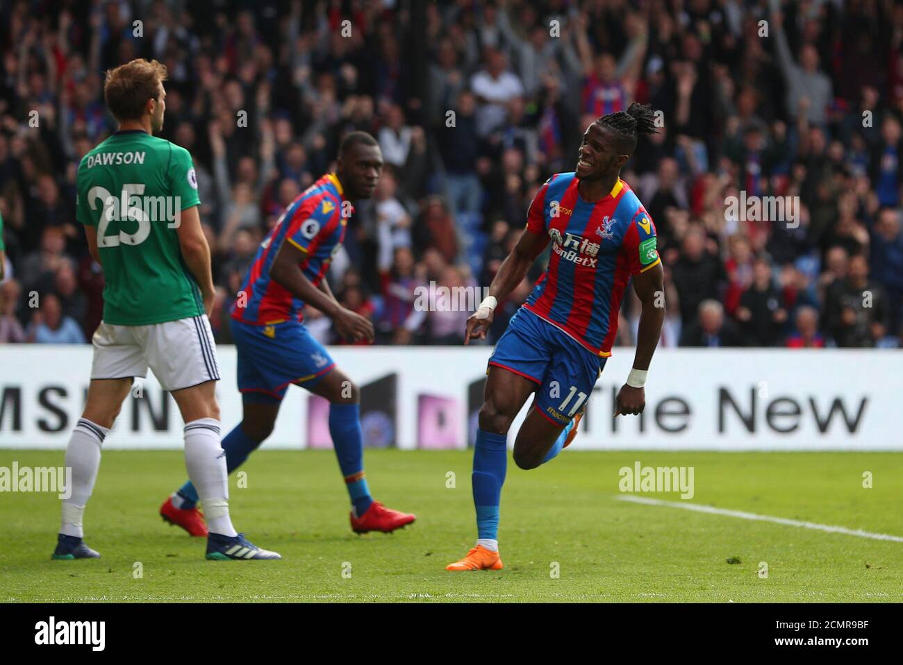 Soccer Football - Premier League - Crystal Palace vs West Bromwich Albion - Selhurst Park, London, Britain - May 13, 2018   Crystal Palace's Wilfried Zaha celebrates scoring their first goal    REUTERS/Hannah McKay    EDITORIAL USE ONLY. No use with unauthorized audio, video, data, fixture lists, club/league logos or 'live' services. Online in-match use limited to 75 images, no video emulation. No use in betting, games or single club/league/player publications.  Please contact your account representative for further details. Stock Photo