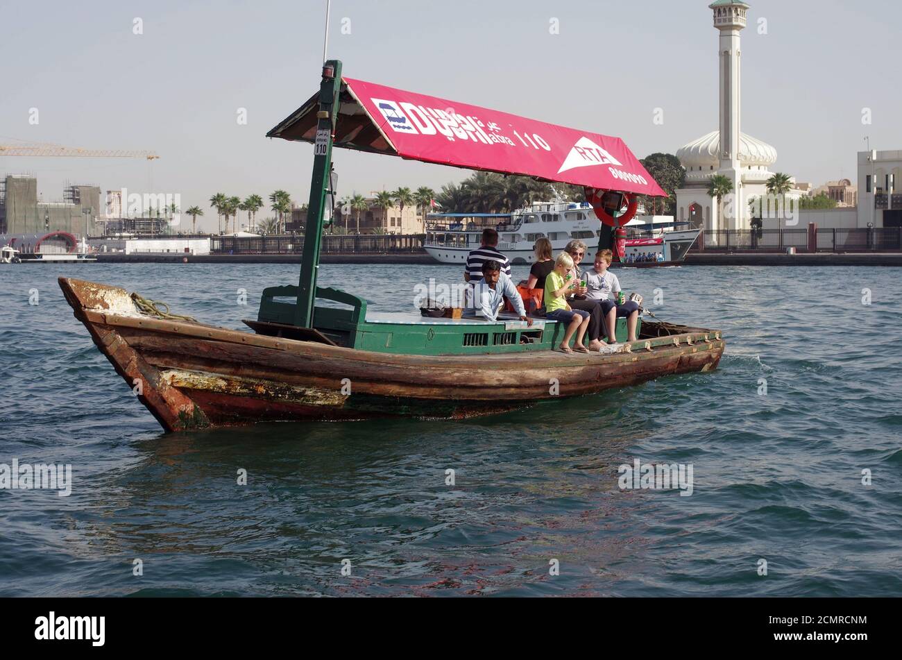 Tourists from Europe make a sea voyage on a small old private wooden boat Stock Photo