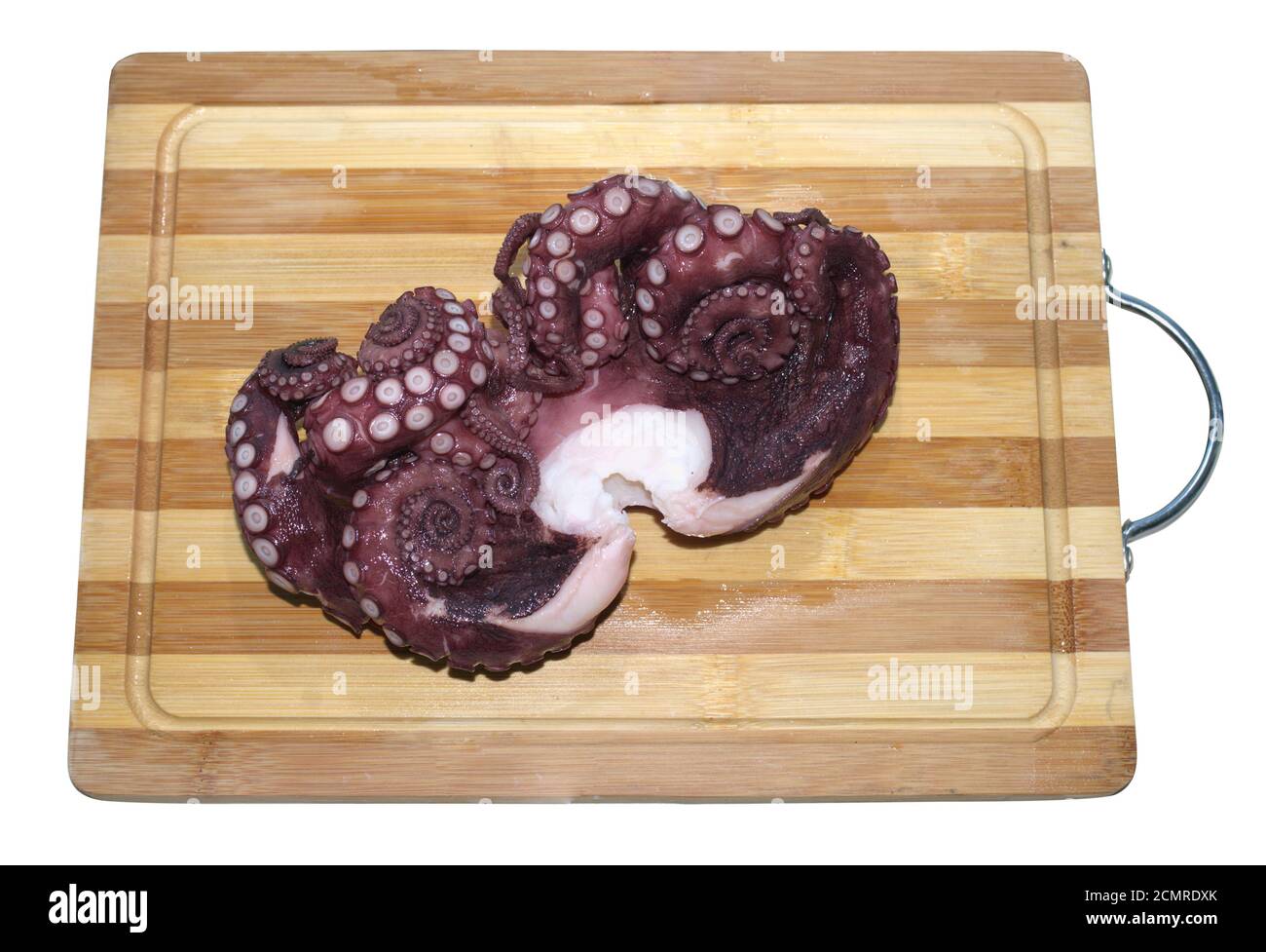 On the wooden kitchen cutting board lies a fresh red marine octopus Stock Photo