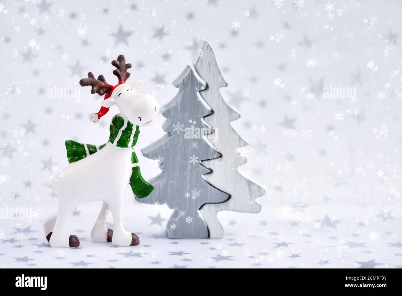 Christmas background with decorative moose and Christmas tree Stock