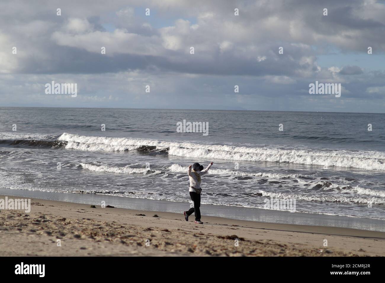Francine Sindoni 70 Exercises As She Walks On An Empty Santa Monica Beach After California Issued A Stay At Home Order Due To Coronavirus Disease Covid 19 In Santa Monica California U S March 25