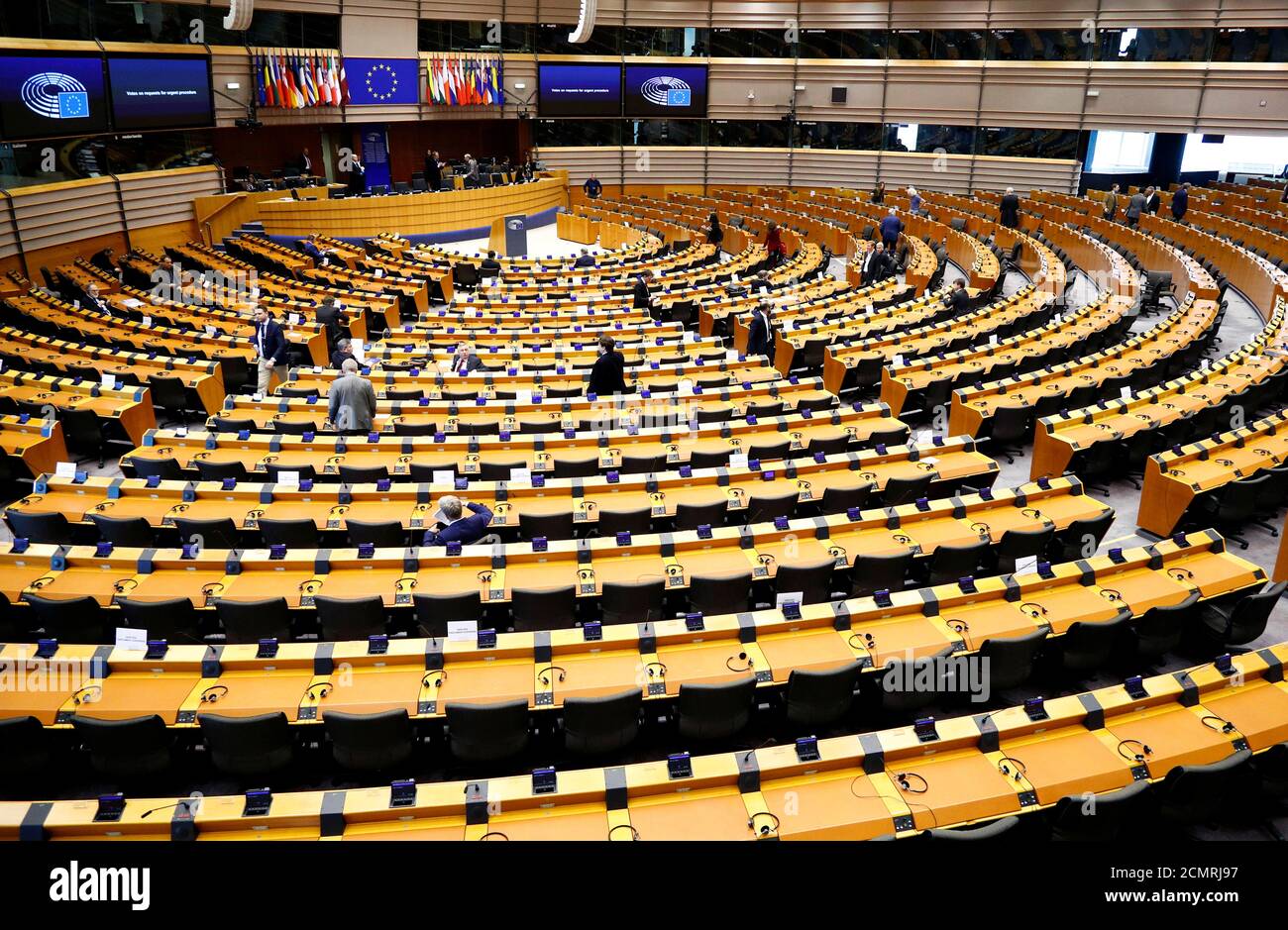 MEPs attend a special session of the European Parliament to approve special measures to soften the sudden economic impact of coronavirus disease (COVID-19), in Brussels, Belgium March 26, 2020. REUTERS/Francois Lenoir Stock Photo