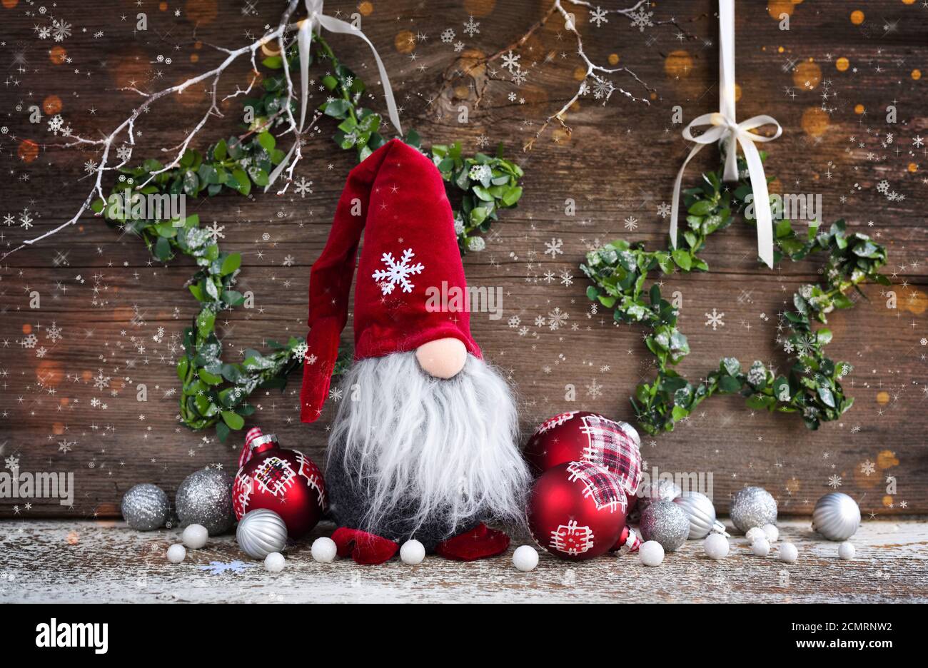 Christmas composition with gnome and festive decorations on wooden  background. Christmas or New Year greeting card Stock Photo - Alamy