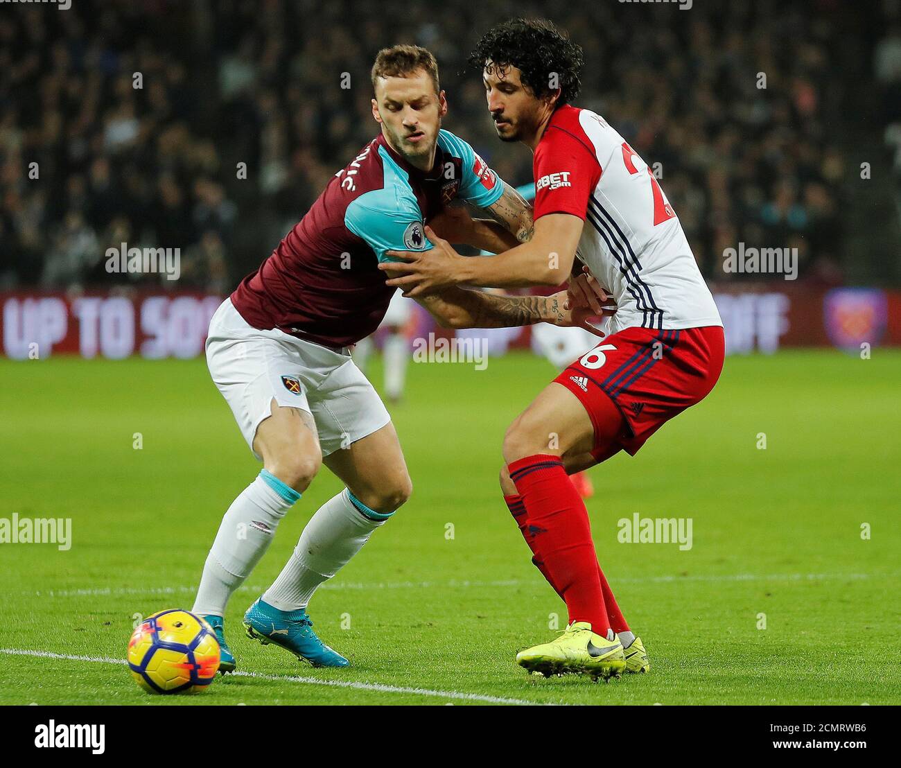 Soccer Football - Premier League - West Ham United vs West Bromwich Albion - London Stadium, London, Britain - January 2, 2018   West Ham United's Marko Arnautovic in action with West Bromwich Albion’s Ahmed Hegazi   REUTERS/Eddie Keogh    EDITORIAL USE ONLY. No use with unauthorized audio, video, data, fixture lists, club/league logos or 'live' services. Online in-match use limited to 75 images, no video emulation. No use in betting, games or single club/league/player publications.  Please contact your account representative for further details. Stock Photo