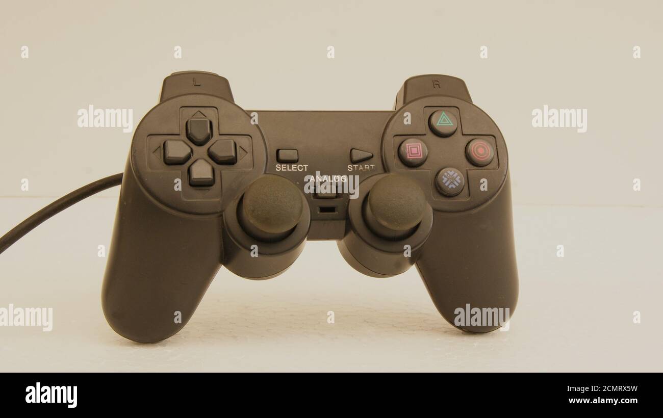 Joystick, black color game controller with controllers, with multiple buttons, used in computer video games, simulators and notebook, white background Stock Photo