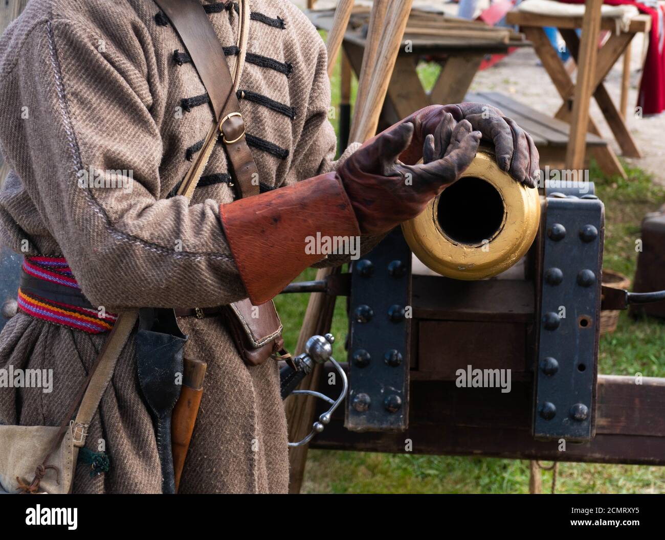 Ancient gun and hands in leather gloves Stock Photo