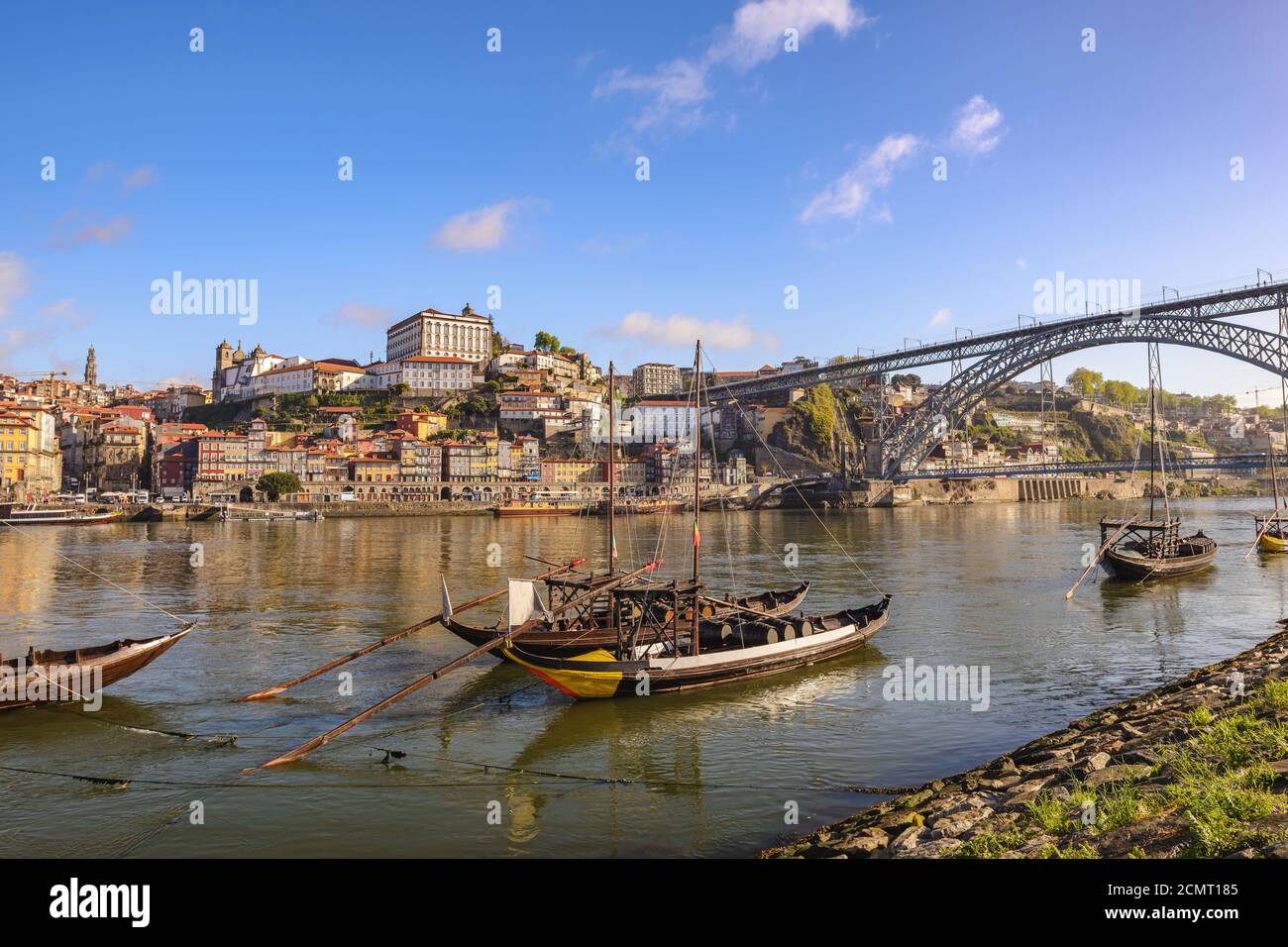 Porto Portugal city skyline at Porto Ribeira and Douro River with Rabelo wine boat and Dom Luis I Br Stock Photo