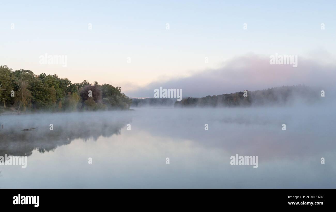 Misty morning - the mist and trees around the lake creating a dreamy ...