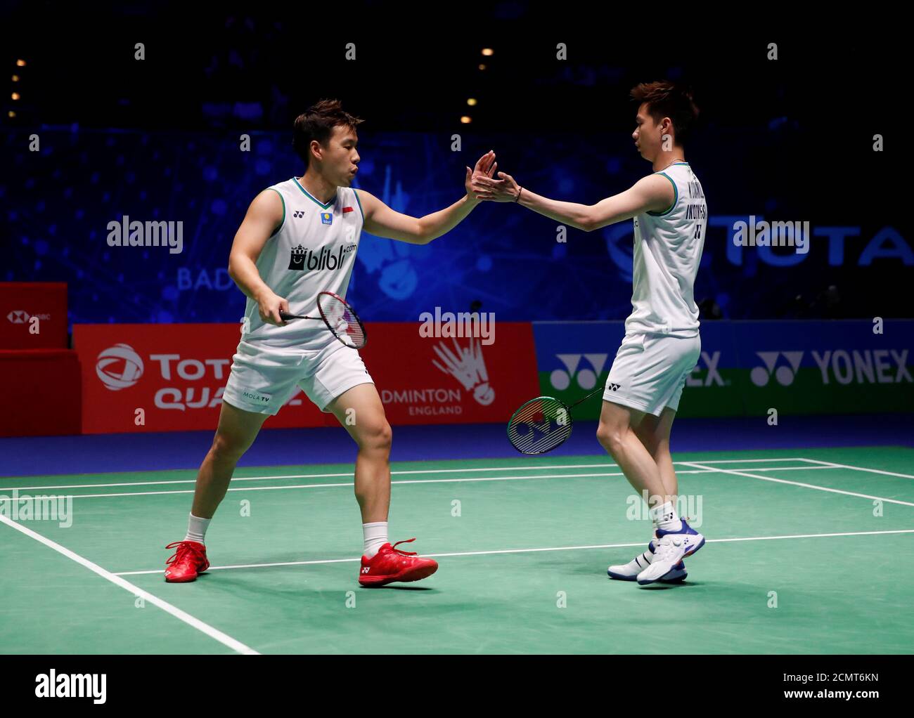 Badminton - All England Open Badminton Championships - Arena Birmingham,  Birmingham, Britain - March 14, 2020 Indonesia's Marcus Fernaldi Gideon and  Kevin Sanjaya Sukamuljo celebrate during their men's doubles semi final  match