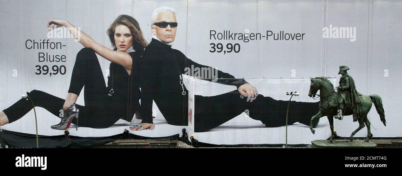 Abseiling workers unveil a giant 1,500 square metre advertisement for  Swedish fashion retailer H&M showing German-born fashion designer Karl  Lagerfeld and U.S. model Erin Wasson on the Unter den Linden boulevard in