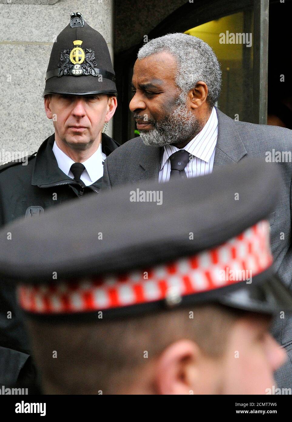 Neville Lawrence, father of murdered teenager Stephen Lawrence, emerges to address members of the media after Gary Dobson and David Norris were sentenced for his murder at the Old Bailey, the Central Criminal Court in London January 4, 2012. Two men who took part in the murder of black teenager Stephen Lawrence in 1993 -- a landmark case which exposed what an inquiry called the 'institutional racism' of London's police force -- were given life sentences on Wednesday.  REUTERS/Toby Melville  (BRITAIN - Tags: CRIME LAW SOCIETY) Stock Photo