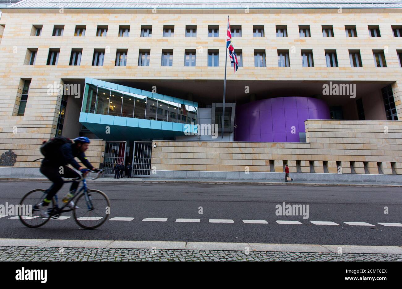 A man cycles past the British Embassy in Berlin November 5, 2013.  Documents leaked by former U.S. National Security Agency contractor Edward Snowden show that Britain's surveillance agency is operating a network of 'electronic spy posts' from within a stone's throw of the Bundestag and German chancellor's office, the Independent reported. NSA documents, in conjunction with aerial photographs and information about past spying activities in Germany, suggest that Britain is operating its own covert listening station close to the German parliament, and Chancellor Angela Merkel's offices in the Ch Stock Photo
