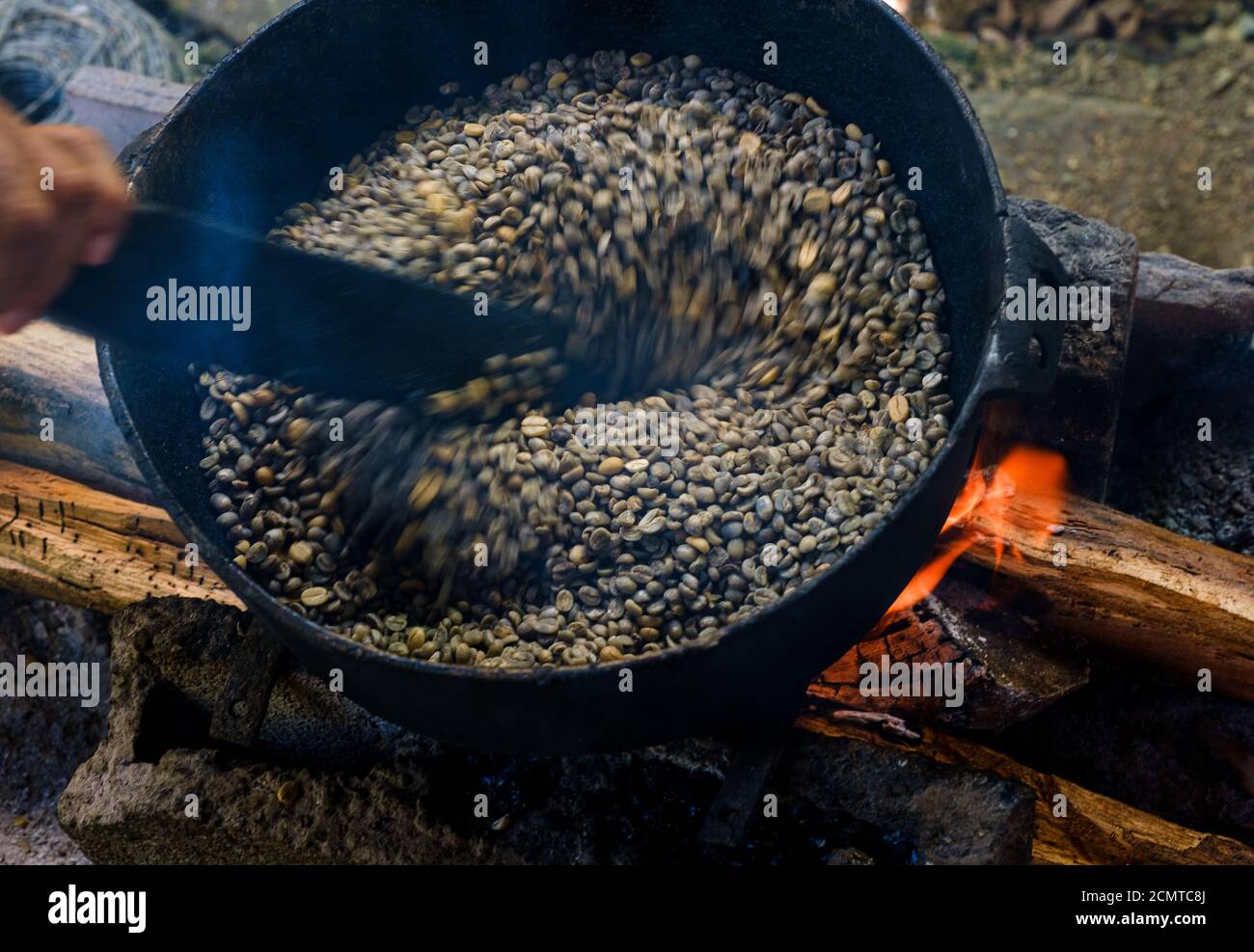 BARACOA, CUBA - CIRCA JANUARY 2020: Detail of cocoa beans being roasted in Baracoa. Cocoa farms are spread and widely known in the region. Cocoa and c Stock Photo