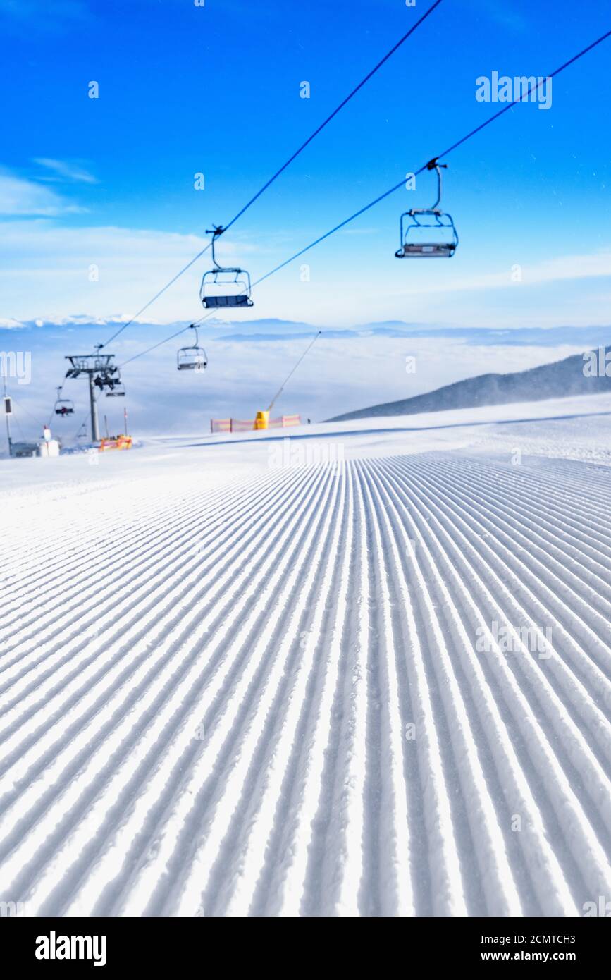 Chairlift carrying skiers up mountain hi-res stock photography and ...