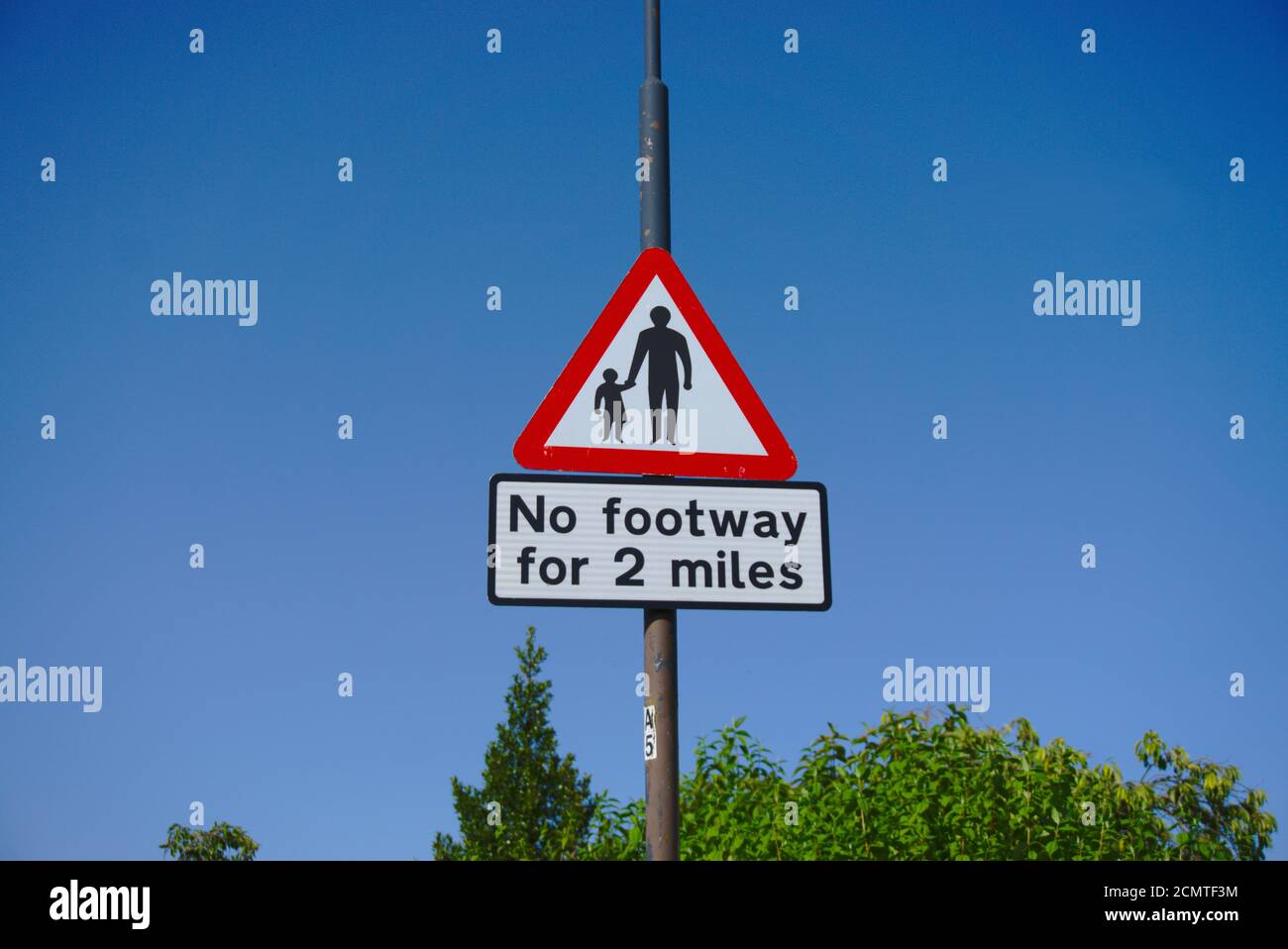 Road sign in Midlothian, Scotland, UK, warning of no footway for two miles. Stock Photo