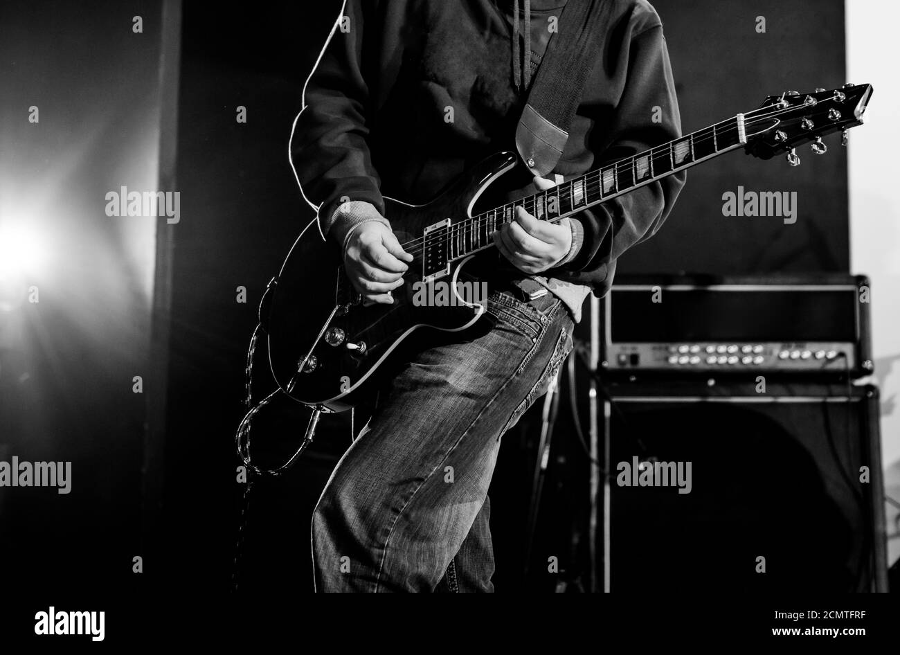 musician playing electric guitar on a stage Stock Photo Alamy
