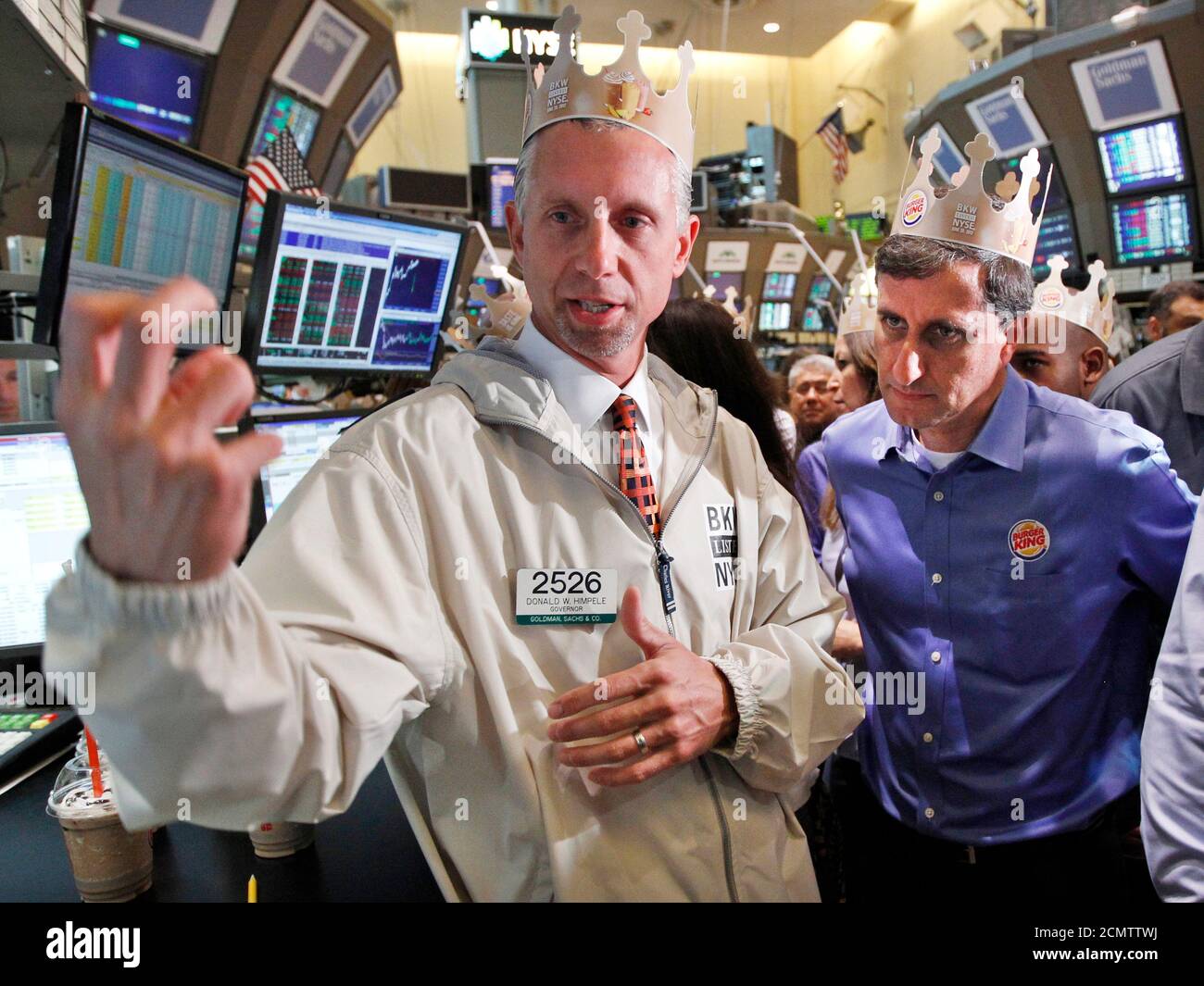 Burger King Corp. CEO Bernardo Hees (R) talks with specialist Donald Himpele (L) following his company's stock began trading at the New York Stock Exchange June 20, 2012. Shares of Burger King Worldwide Holdings Inc opened at $14.50 on Wednesday, as it started its first round of trading, less than two years of going private in a $3.26 billion sale to Brazilian investment fund 3G Capital Management LLC. REUTERS/Brendan McDermid (UNITED STATES - Tags: FOOD BUSINESS) Stock Photo