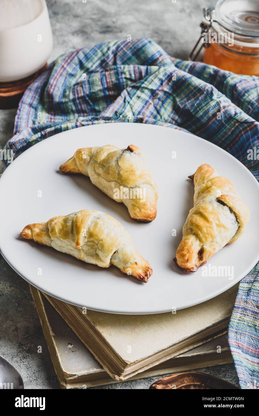 Croissants stuffed with nuts and chocolate for breakfast Stock Photo