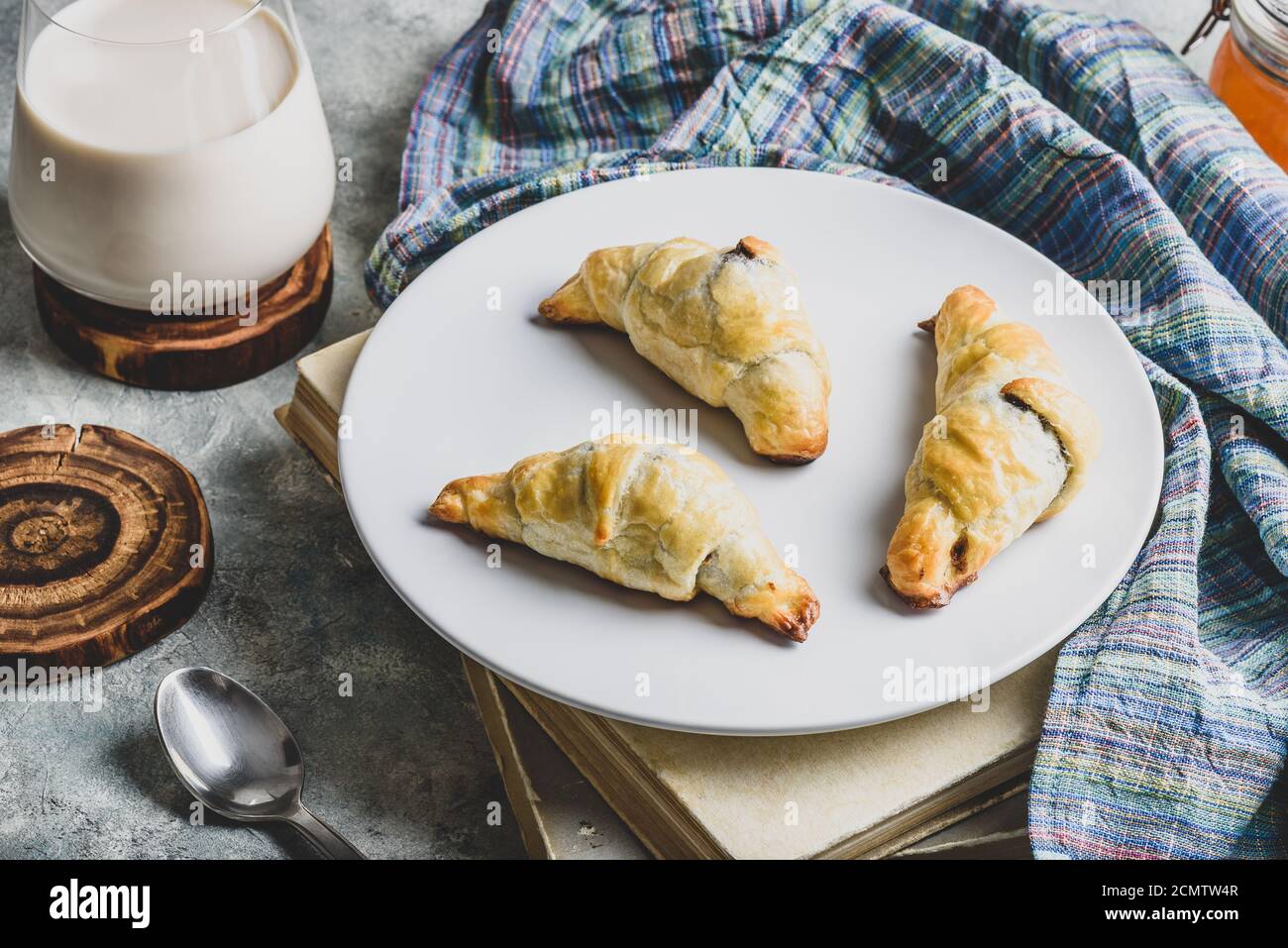 Croissants stuffed with nuts and chocolate for breakfast Stock Photo