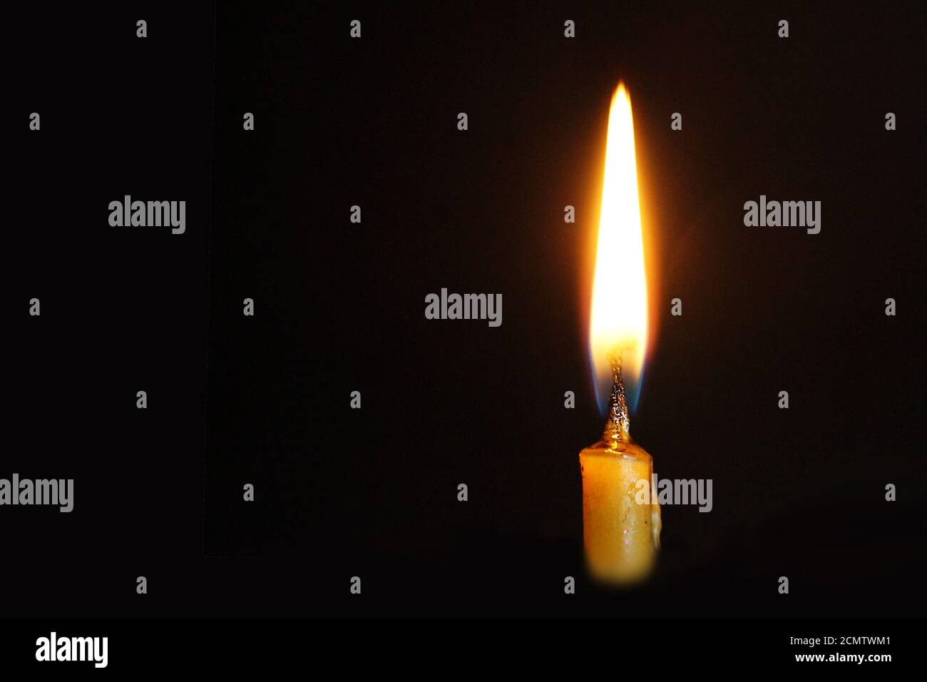 burning wax candle close up on black background, copy space Stock Photo ...