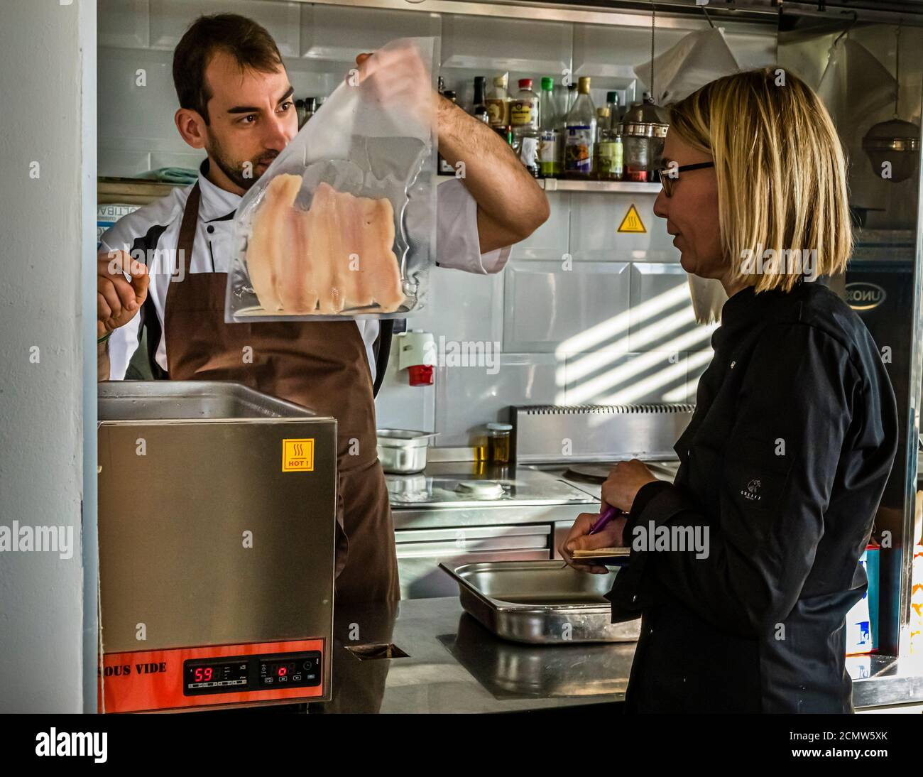 Preparing trout sous vide. Culinary Institute of Budapest with professional chef Lászlo Papdi gives instructions Stock Photo