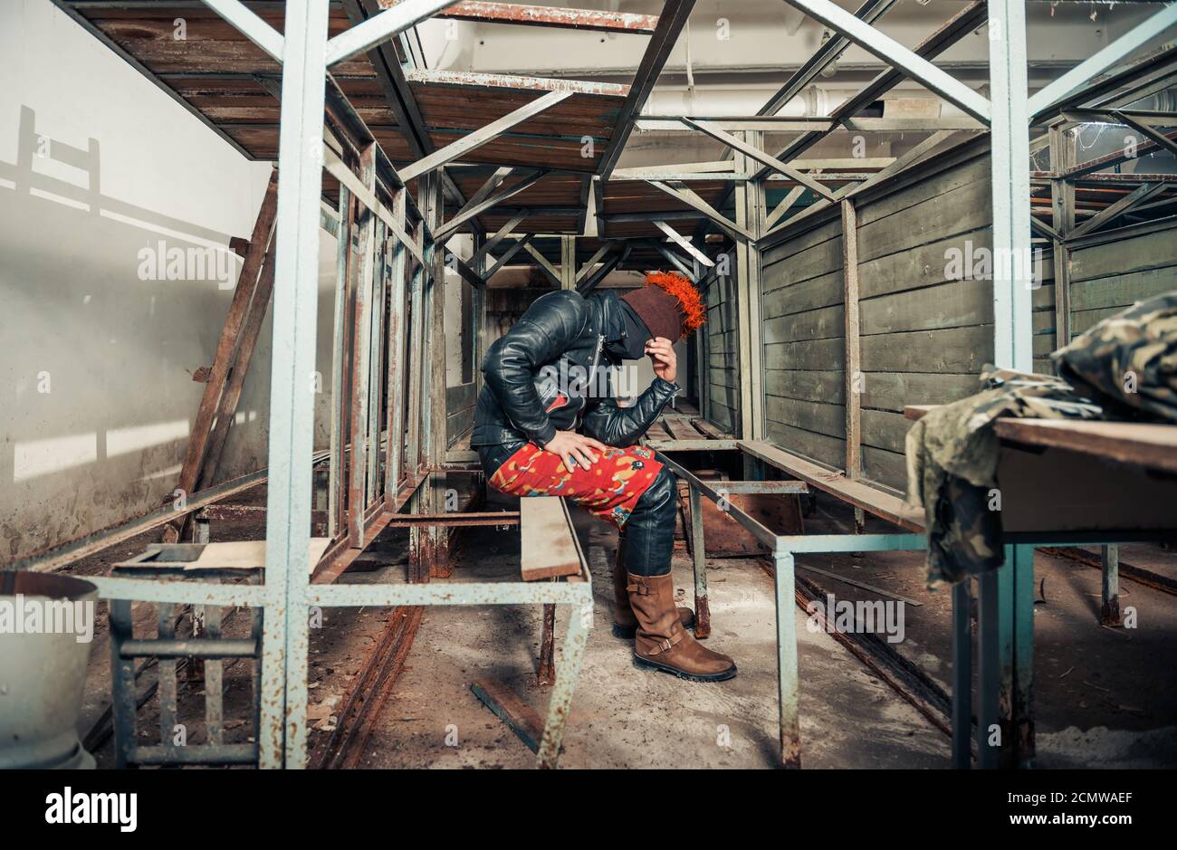 man in black funky clothes portrait in basement constructions Stock Photo