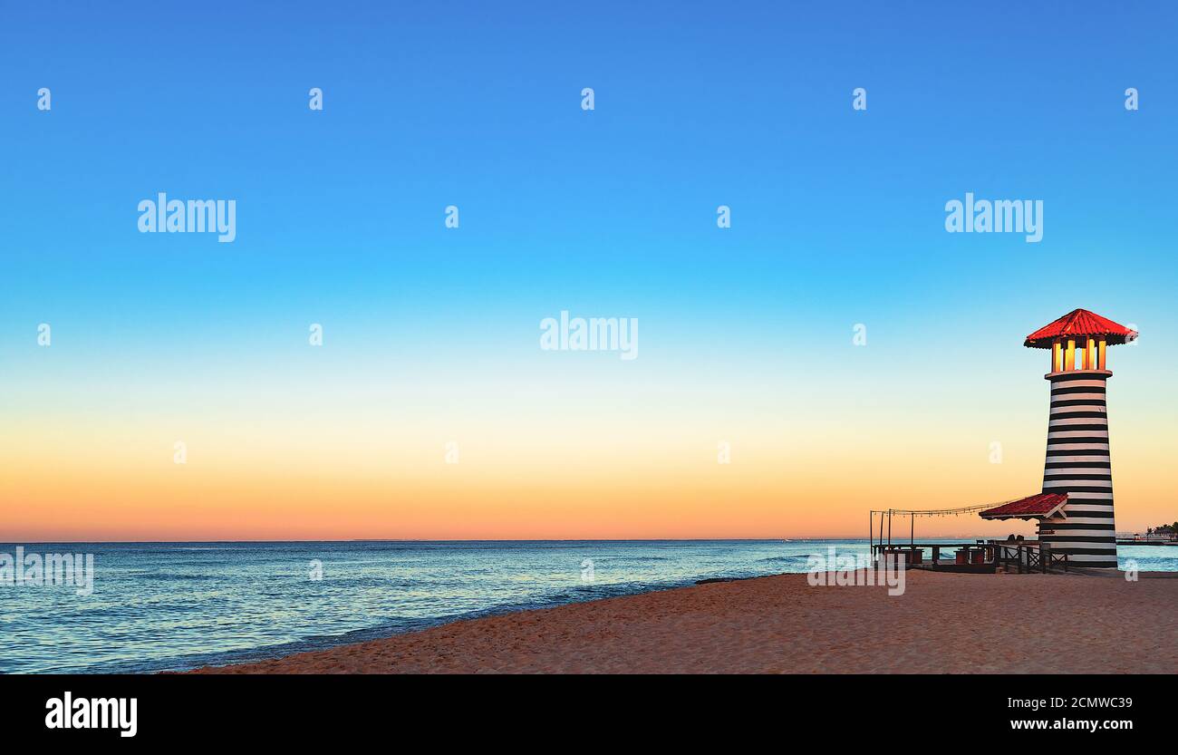 caribbean sea sunrise lighthouse Stock Photo