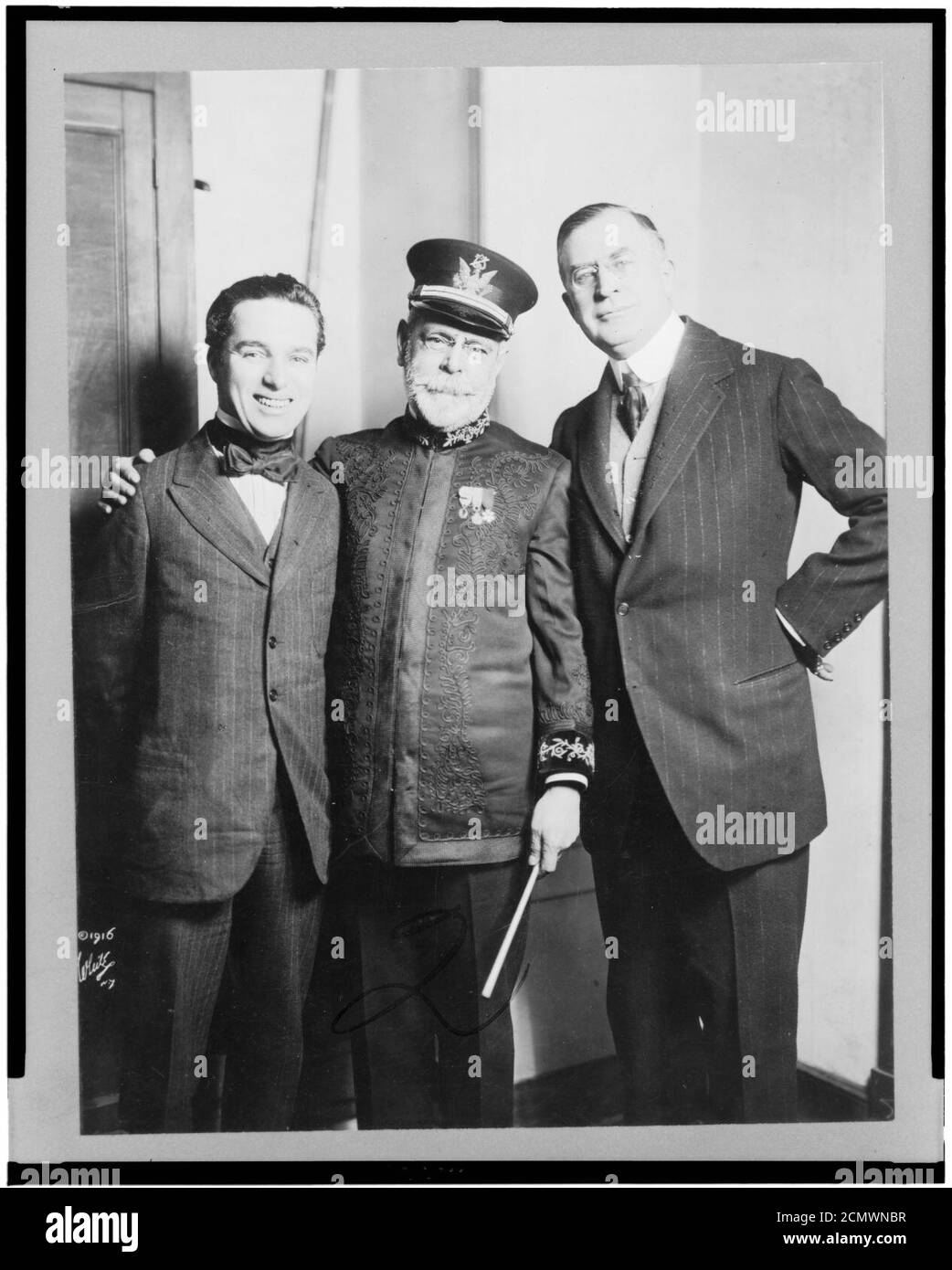 John P. Sousa, Charlie Chaplin, and Clifford Harmon, full-length portrait, standing, facing front Stock Photo