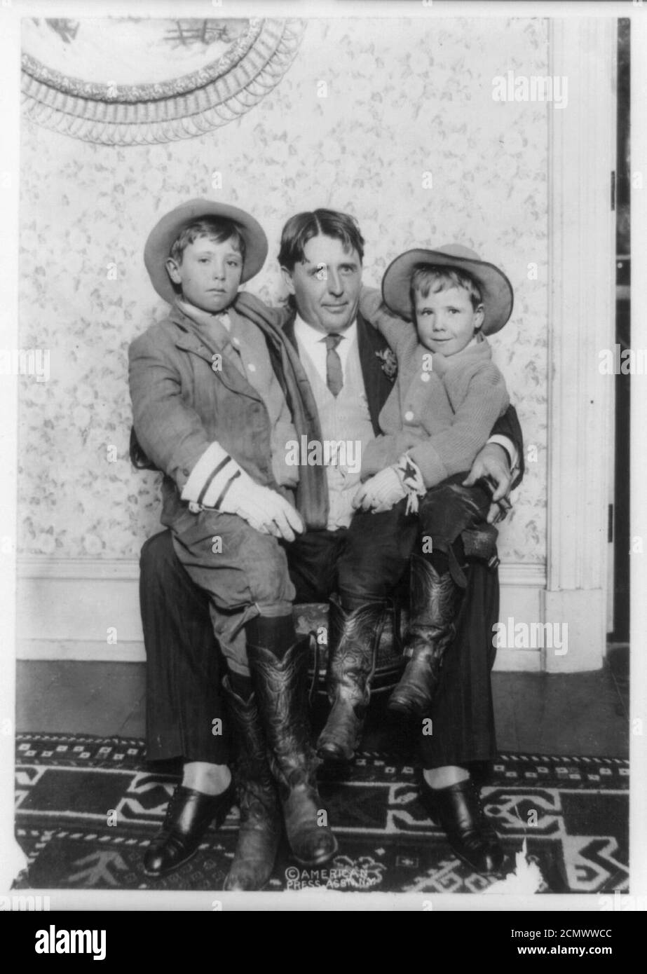 John Reeves Abernathy, fulllength portrait, seated, holding his two