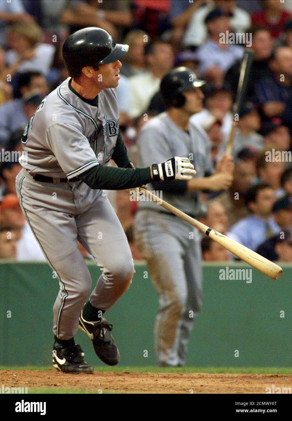 Tampa Bay Devil Rays Andy Sheets (L) and teammate Steve Cox (rear) watch as Sheets' three-run home run off Red Sox pitcher Frank Castillo clears Fenway Park's 'Green Monster' left field wall July 24, 2002 to cap a six-run second inning for Tampa Bay in Boston. Sheets drove in teammates Randy Winn and Carl Crawford. REUTERS/Jim Bourg  JRB Stock Photo